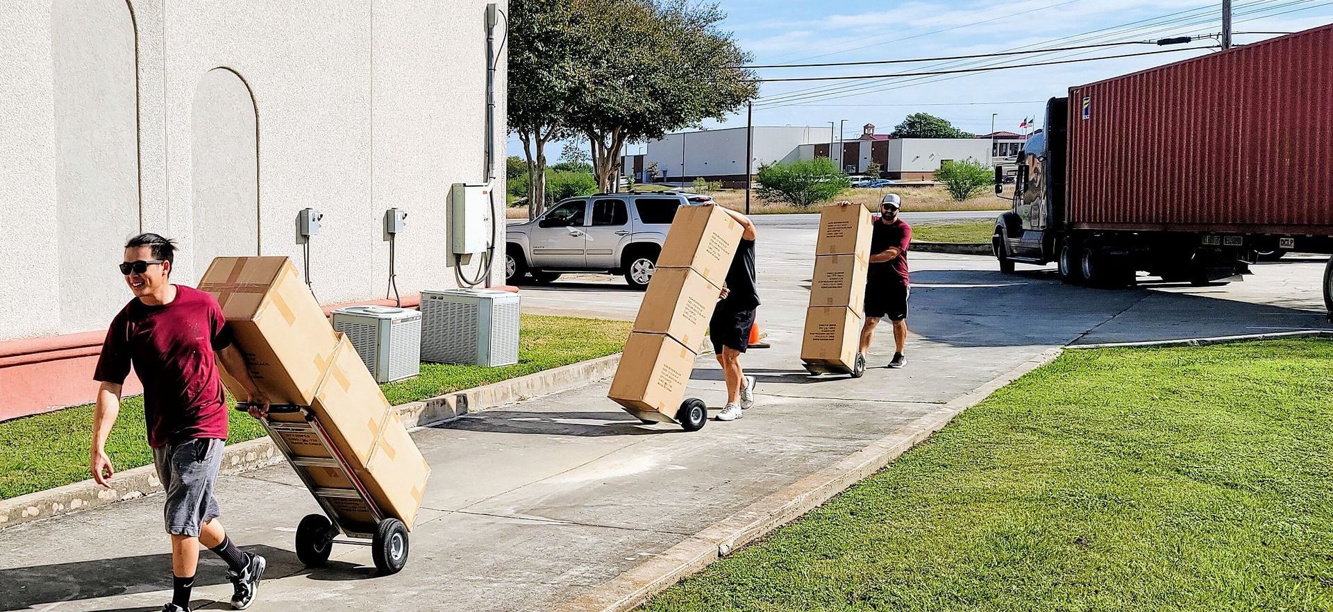 Men Pulling Boxes